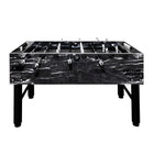 Marble-patterned foosball table on a white background