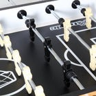 Players on a Atomic Pro Force Foosball Table by DMI Sports available at Foosball Planet.